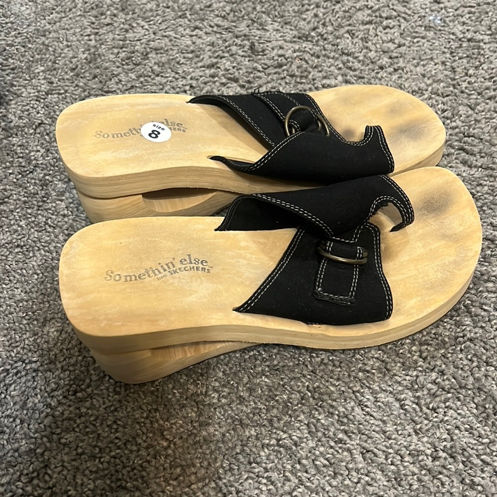 Black platform Skechers